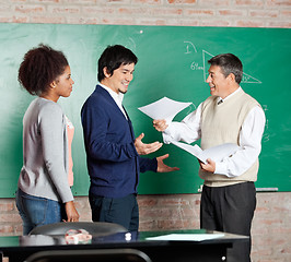 Image showing Professor Giving Test Result To Male Student At Classroom