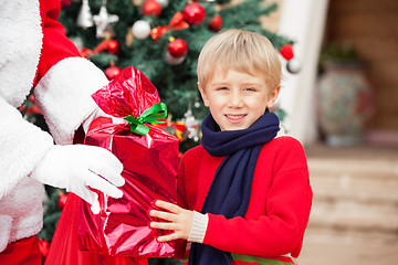 Image showing Boy Taking Gift From Santa Claus