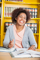 Image showing Student With Eyes Closed Sitting At Table In Library