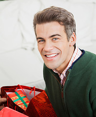 Image showing Happy Man With Bag Of Christmas Presents