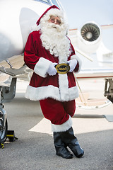 Image showing Santa Leaning On Private Jet At Airport Terminal