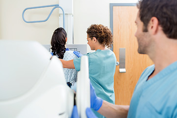 Image showing Nurse Adjusting Xray Machine In Examination Room