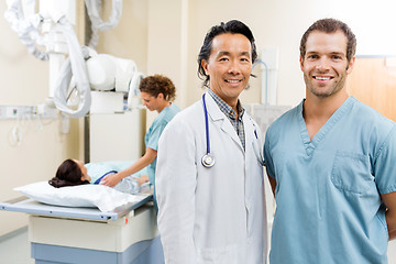 Image showing Happy Medical Team With Patient In Hospital Room