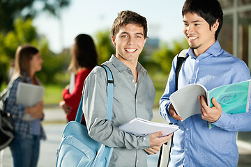 Image showing Man With Friend Standing On College Campus