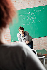 Image showing Student With Hand On Chin Looking At Friend In Classmate