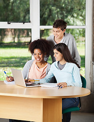 Image showing Students With Laptop Studying Together In Classroom