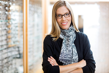 Image showing Woman Wearing Glasses With Arms Crossed In Store