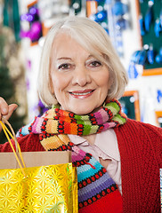 Image showing Beautiful Woman Carrying Shopping Bags At Store