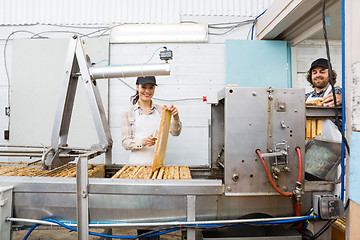 Image showing Beekeepers Working At Honey Extraction Plant