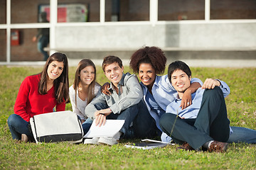 Image showing Students Sitting On Grass At College Campus