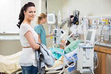 Image showing Beautiful Woman With Nurse Examining Patient