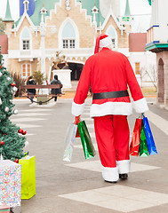 Image showing Santa Claus With Bags Walking In Courtyard