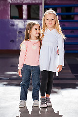 Image showing Girl Standing Arms Around With Female Friend In Kindergarten