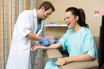 Image showing Patient Screaming While Doctor Drawing Blood Sample