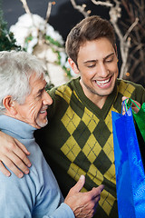 Image showing Happy Father And Son In Christmas Store