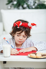 Image showing Boy Writing Letter To Santa Claus