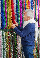 Image showing Senior Man Shopping For Tinsels