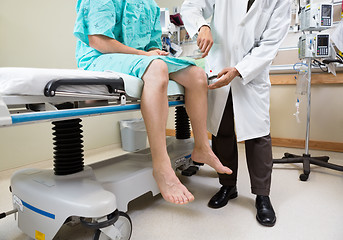 Image showing Neurologist Examining Patient's Knee With Hammer In Hospital