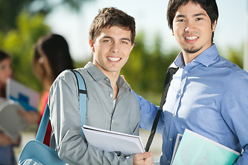 Image showing Male Friends Smiling On College Campus