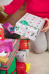 Image showing Senior Woman Sitting By Christmas Gifts