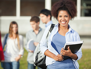 Image showing Woman Holding Books On University Campus