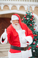 Image showing Confident Santa Claus Gesturing Thumbsup