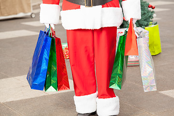 Image showing Santa Claus Carrying Shopping Bags