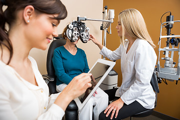 Image showing Optometrists Examining Senior Woman In Store