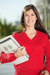 Image showing Happy Student With Books Standing On Campus