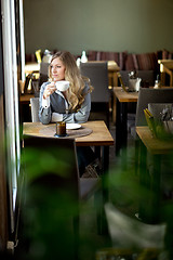 Image showing Woman in Cafe Day Dreaming