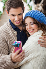 Image showing Romantic Couple Looking At Gift Box In Store