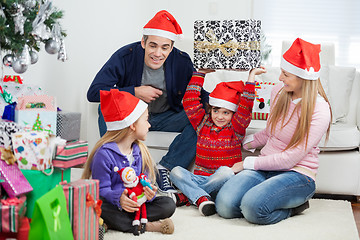 Image showing Playful Family With Christmas Gifts