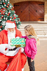 Image showing Girl Receiving Present From Santa Claus