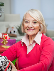 Image showing Senior Woman With Christmas Gift