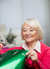 Image showing Senior Woman Looking In Bag