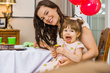 Image showing Happy Woman With Daughter Eating Birthday Cake