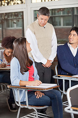 Image showing Students Looking At Teacher While Giving Exam In Classroom