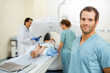 Image showing Nurse With Colleague And Radiologist Preparing Patient For CT Sc