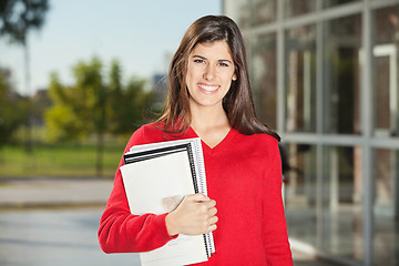 Image showing Student With Books Standing On College Campus