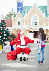 Image showing Santa Claus About To Embrace Girl