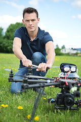 Image showing Engineer Fixing Propeller Of UAV Spy Drone