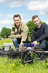 Image showing Technicians With Laptop And Digital Tablet By UAV