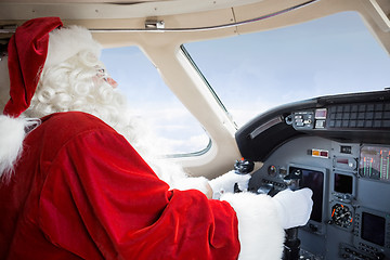 Image showing Santa In Cockpit Flying Private Jet