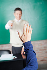 Image showing Student's Hand With Professor Pointing At Him In Classroom