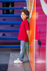 Image showing Unhappy Boy Standing Against Wall