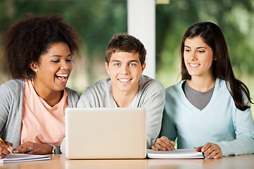 Image showing Student With Friends Looking At Laptop In Classroom