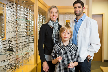 Image showing Boy With Optometrist And Mother In Store