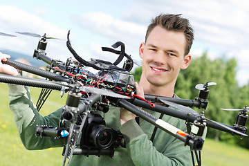 Image showing Technician Holding UAV Octocopter