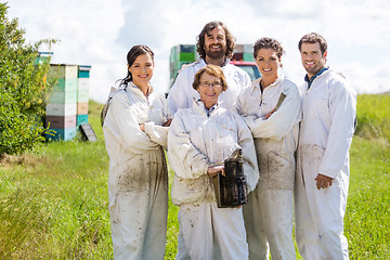 Image showing Team Of Confident Beekeepers At Apiary