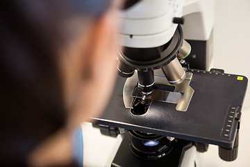 Image showing Scientist Using Microscope In Laboratory
